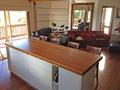 Sliding bench top to seat guests around both sides of island cabinets when entertaining 1