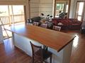Sliding bench top to seat guests around both sides of island cabinets when entertaining 2